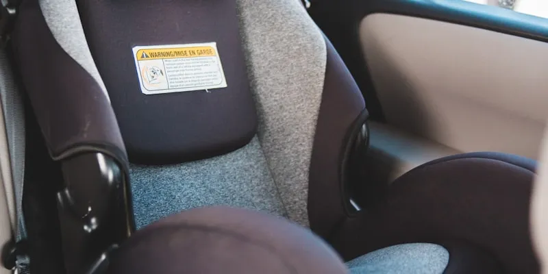 Child car seat with harness straps ready for travel